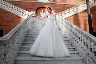 Two Oaks bride on outdoor grand stairs