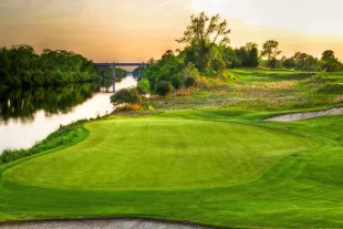 Love Course at sunet with green and river along the side