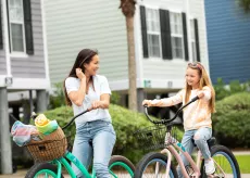 Mom and daughter ride bikes