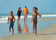 Children running on the beach