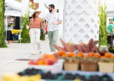 Couple walking through farmers market