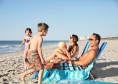 Family playing on the beach