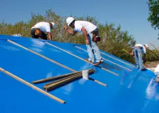 Crew works on house for disaster relief