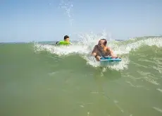 Summer surfing with dad and son