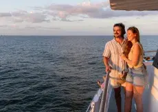 A couple looks at the sunset on the Crazy Sister Marina sunset cruise.