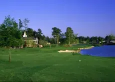 Long Bay Club clubhouse overlooking water with greens