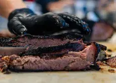Fullybelly BBQ cutting brisket