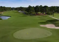Pinehills fairway with traps, greens and golf cart path