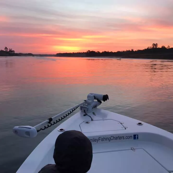 Sunrise and still waters start the fishing day at Captain Smiley Fishing Charters