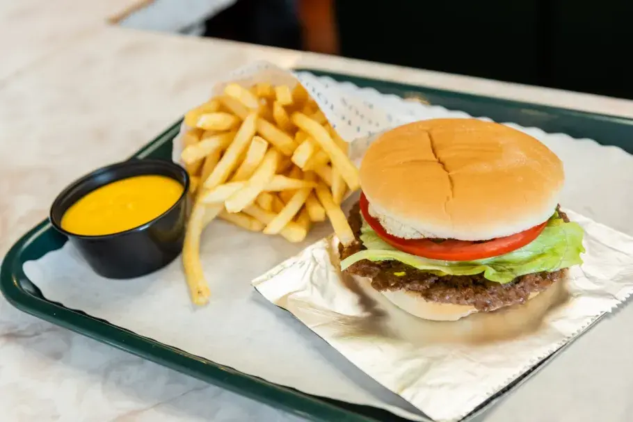 Cheeseburger and fries on display