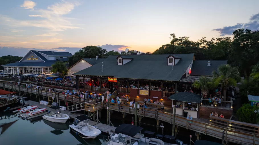 MarshWalk drone shot with the sunset over the restaurants