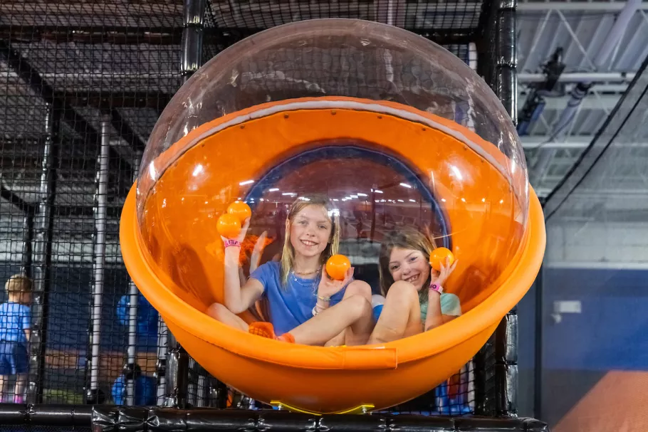 Sky Zone girls in plastic ball