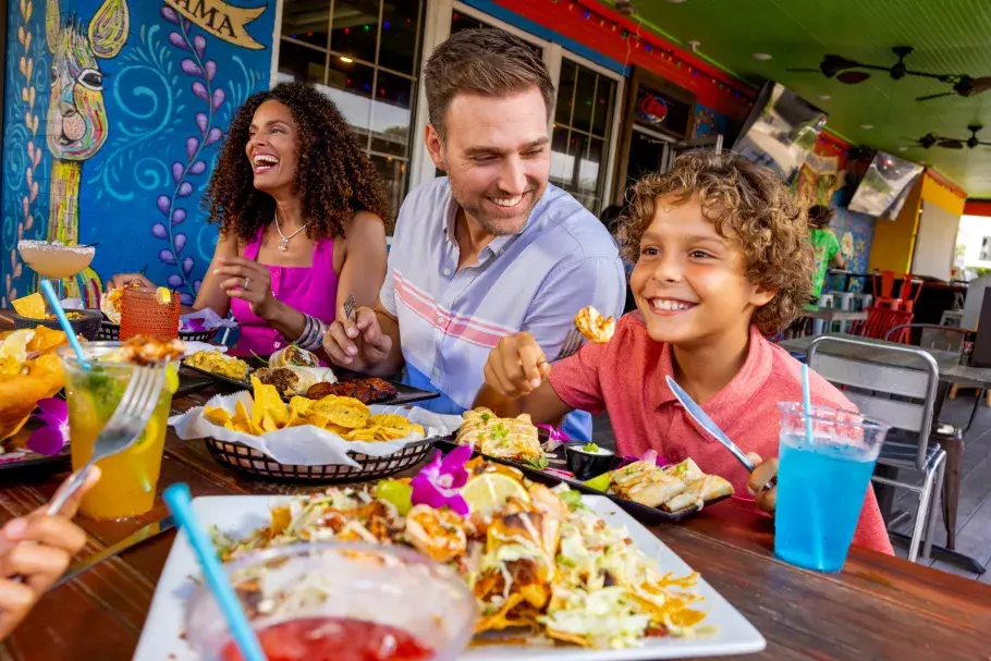 Family eating at Chimichangallama in Surfside