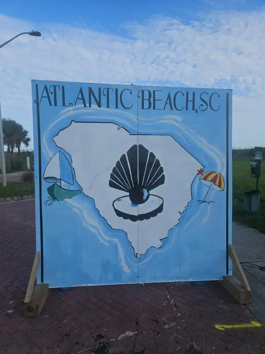 Atlantic Beach mural with SC outline and a black pearl in the middle.
