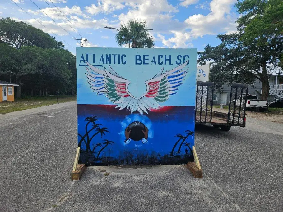 Atlantic Beach mural includes colorful wings to pose in front of.