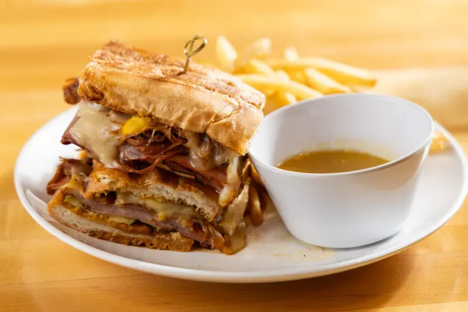 Sandwich with sauce and fries on the side