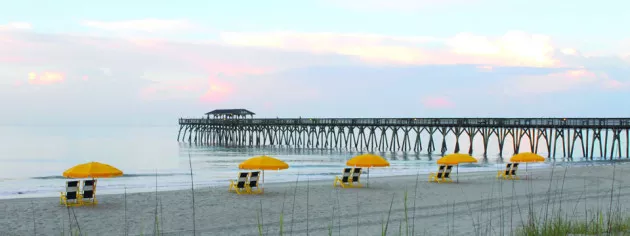 MB State Park Pier with yellow chairs on beach