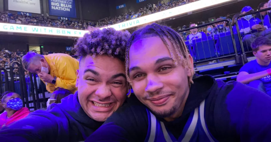 University of Kentucky fans taking a selfie at a basketball game.
