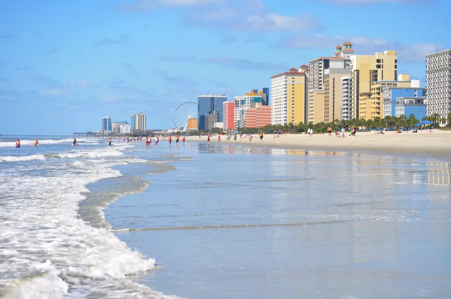 Beachfront photo with hotel in background