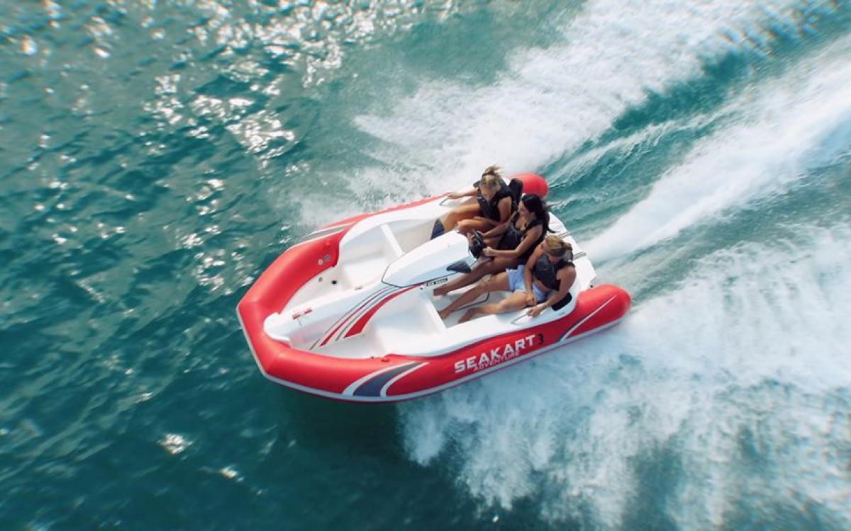Aerial view of Seakart on the ocean with three girls