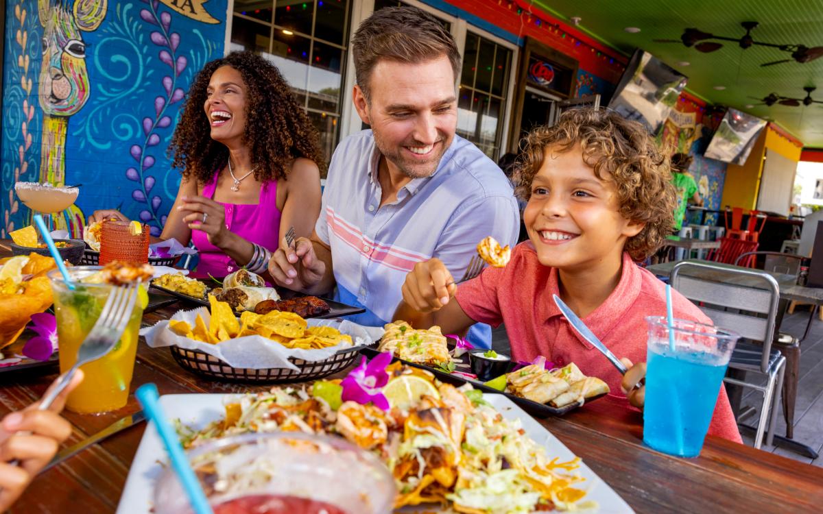 Family eating at Chimichangallama in Surfside